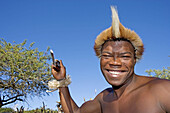 Zulu fighting with a spear. The Simunye zulu village where visitors can be accomodated in zulu style, traditional chief Biyela. Kwazulu-Natal province. South Africa