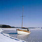 Boat on ice. Moldaustausee. Czech Republic
