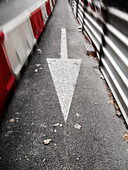 Arrow sign in asphalt, Valencia, Spain