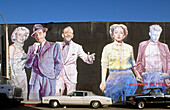Cars by mural on a wall, Los Angeles downtown. California, USA