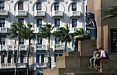 Monument at Main Square with 1900 style hotel in background, Alexandria. Egypt
