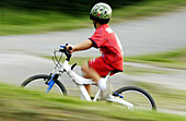 Boy riding a bicycle