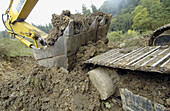 Construction of forest trail with black slag from foundry. Ormaiztegi, Guipúzcoa. Euskadi, Spain