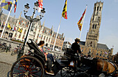 Carriages in Markt (Market Square). Brugge. Flanders, Belgium