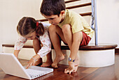 Caucasians, Child, Childhood, Children, Color, Colour, Computer, Computers, Contemporary, Families, Family, Female, Full-body, Full-length, Girl, Girls, Home, Horizontal, Human, Indoor, Indoors, Infan
