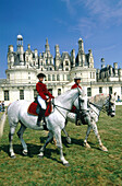 Horsemen in front of Chambord Castle. Val-de-Loire. France