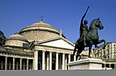 Equestrian statue and church of San Francesco di Paola at Plebiscito Square. Naples. Italy