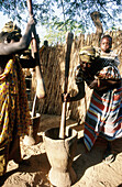 Women grinding millet to obtain flour in a village in Casamance. Senegal