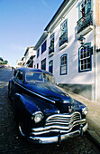 Vintage american car in a sloppy street. Historic city of Ouro Preto. Minas Gerais. Brazil