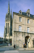 Classical stone building and cathedral in background. Quimper. Finistere. Brittany. France