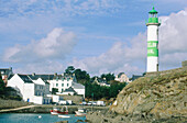 Harbour and lighthouse in an aven . Doelan. Finistere. Brittany. France