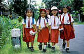 Young girls going to school. Bali Island. Indonesia