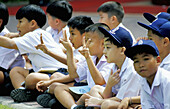 Children watching traditional folk dances performed on Sunday. Vimanmek Palace. Bangkok. Thailand