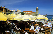 Cafe terrace. Historic Village and Harbour. Collioure. Pyrenees-Orientales. Languedoc Roussillon. France