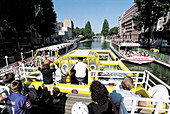 Tour boat on Canal Saint-Martin. Paris. France