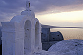 White washed Church belfry. Ia village. Santorini (Cyclades). Greece