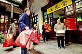 People going to intimate ceremony for grandfather s death first anniversary at the Jade Buddha temple. Shanghai. China