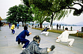 Early morning Tai Chi gymnastics on the Lake shore Hangzhou. Zhejiang province, China