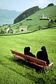 Two nuns sitting on a bench. Apenzell. Switzerland