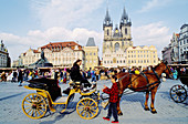 Horse carriage and Tyn church at Staromestské Namesti (Old Town Square). Prague. Czech Republic