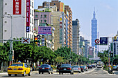 Street and traffic with Taipei 101 tower in background. Taipei. Taiwan