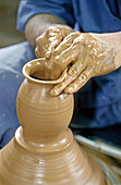 Close up on a traditional potter at work. Okinawa Island. Japan.