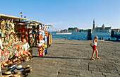 Quay in San Marco and souvenir sellers. Venice. Italy.