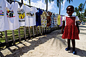 T-shirts for sale to the tourists. Grande Anse beach. Grenada, Caribbean