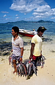 Fishermen returning from fishing. La digue Island. Seychelles