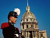 Saint-Cyr military school officer by the golden dome of Hôtel des Invalides. Paris, France