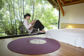 Young girl relaxing in a Villa at Aranzazu, Aizkorri Natural Park, near Oñati. Gipuzkoa, Basque Country, Spain