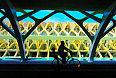 Bikers at City of Arts and Sciences by Santiago Calatrava, Valencia. Comunidad Valenciana, Spain
