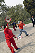 Senior citizens do exercise, tai-chi, every morning at Temple of Heaven Park. Beijing. China