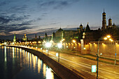 Moscow, Russia, Kremlevskaya Nab, Kremlin Walls, Neva River, at twilight, with traffic, rush hour, car light streaks.