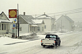 Driving in winter, snowstorm in Sainte-Flavie. Gaspésie, Quebec, Canada