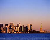 Statue of liberty & downtown skyline, Manhattan, New York, USA.