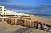 Wooden barriers supposed to hinder the sand from invading the promenade. Barbate. Cádiz province. Andalusia. Spain