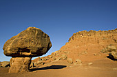 A Balanced Rock is created by softer rock which erodes away, leaving overhangs of hard rock. Paria Canyon-Vermilion Cliffs Wilderness, Glen Canyon National Recreation Area, Arizona, USA.