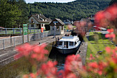 Houseboat in Ecluse 21 Boat Lock, Crown Blue Line Calypso Houseboat, Canal de la Marne au Rhin, Lutzelbourg, Alsace, France