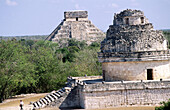 El Caracol (the Snail) observatory and The Castle (Pyramid of Kukulcan) in background, Mayan ruins of Chichen Itza. Yucatan, Mexico