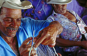 Fisherman mending fishing nets, Martinique, France