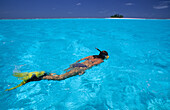 A woman snorkeling near tiny Prison Island, Australian