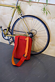 Bag leaning against bicycle