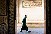 Passerby in front of koran school Medersa ben Youssef, Morocco, Africa