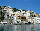 Greece, Simi, Dodecanese, Simi Town, houses at the harbour, houses on a slope