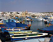 Malta, Marsaxlokk, fishing port, fishing boats , Luzzi, church