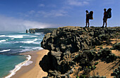 Two people admiring the view, view to The Apostels in Port Campbell National Park, Great Ocean Walk, Victoria, Australia