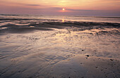 Setting sun at Blakeney Point. Norfolk, UK