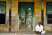 Old man sitting down. India