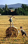 Two boys playing in a field